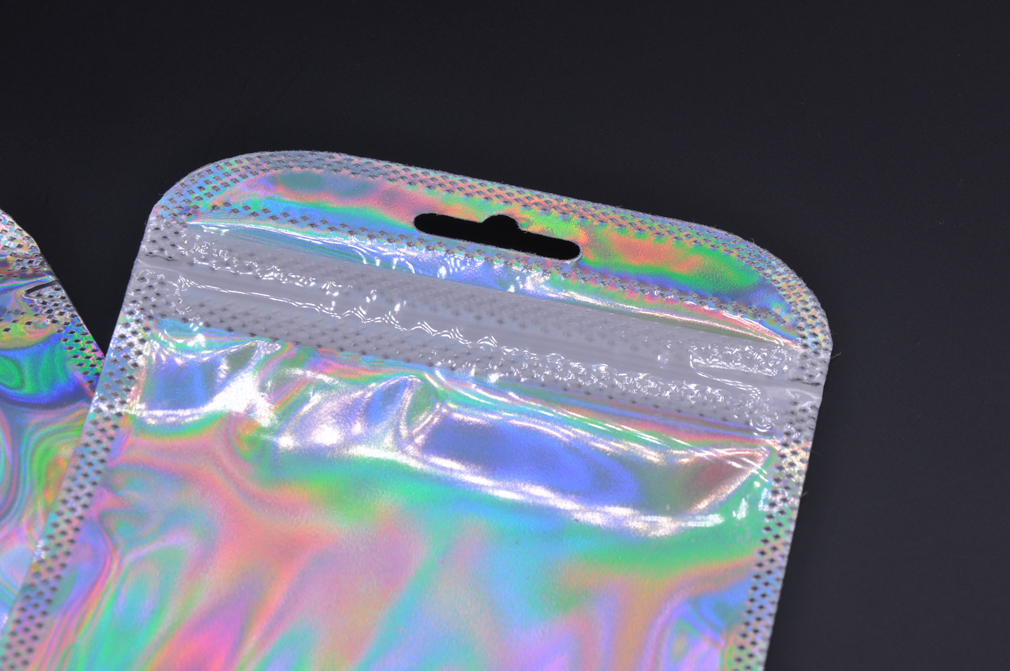 Pochette à bijoux en plastique holographique avec fermeture zippée et feuille d'aluminium